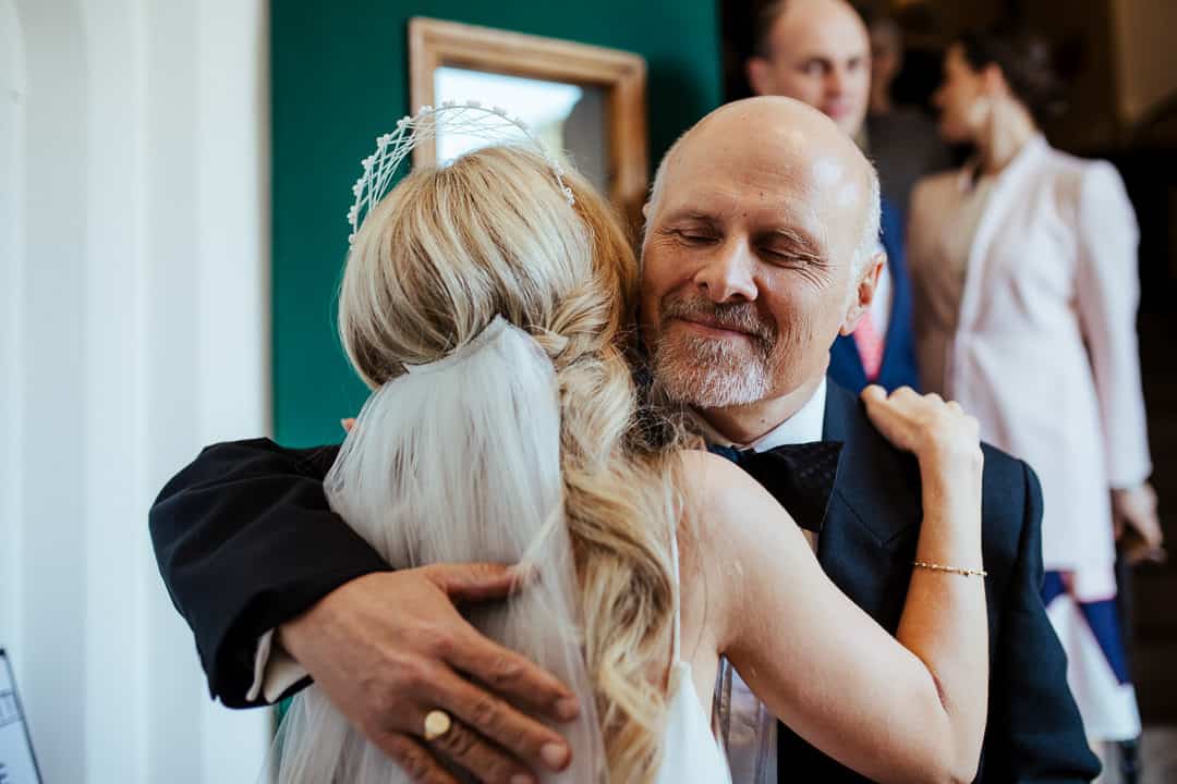father of the groom welcomes bride into the family