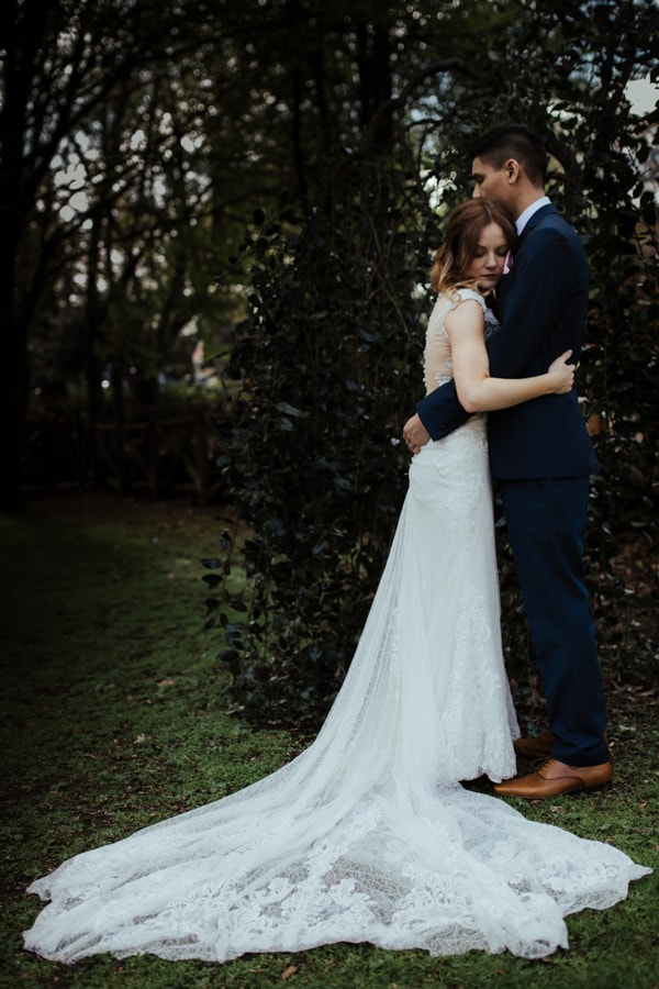 intimate photo of bride and groom in city park