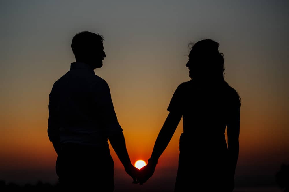 silhouettes of a couple setting sun engagement session dublin
