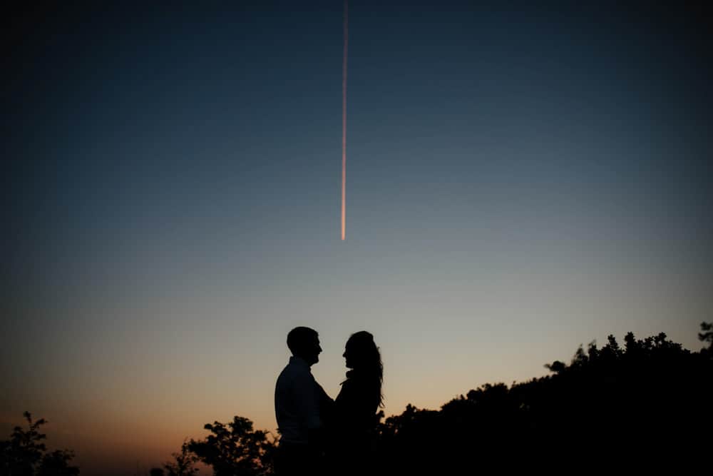 silhouette of a couple and shooting stars