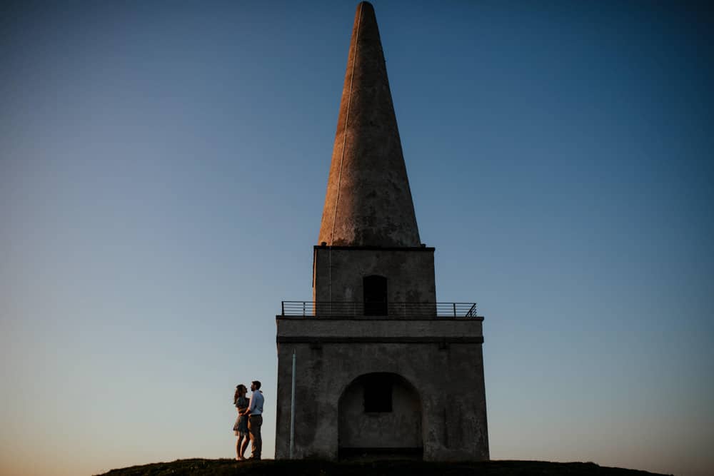 couple beside the tower on killiney hill engagement session