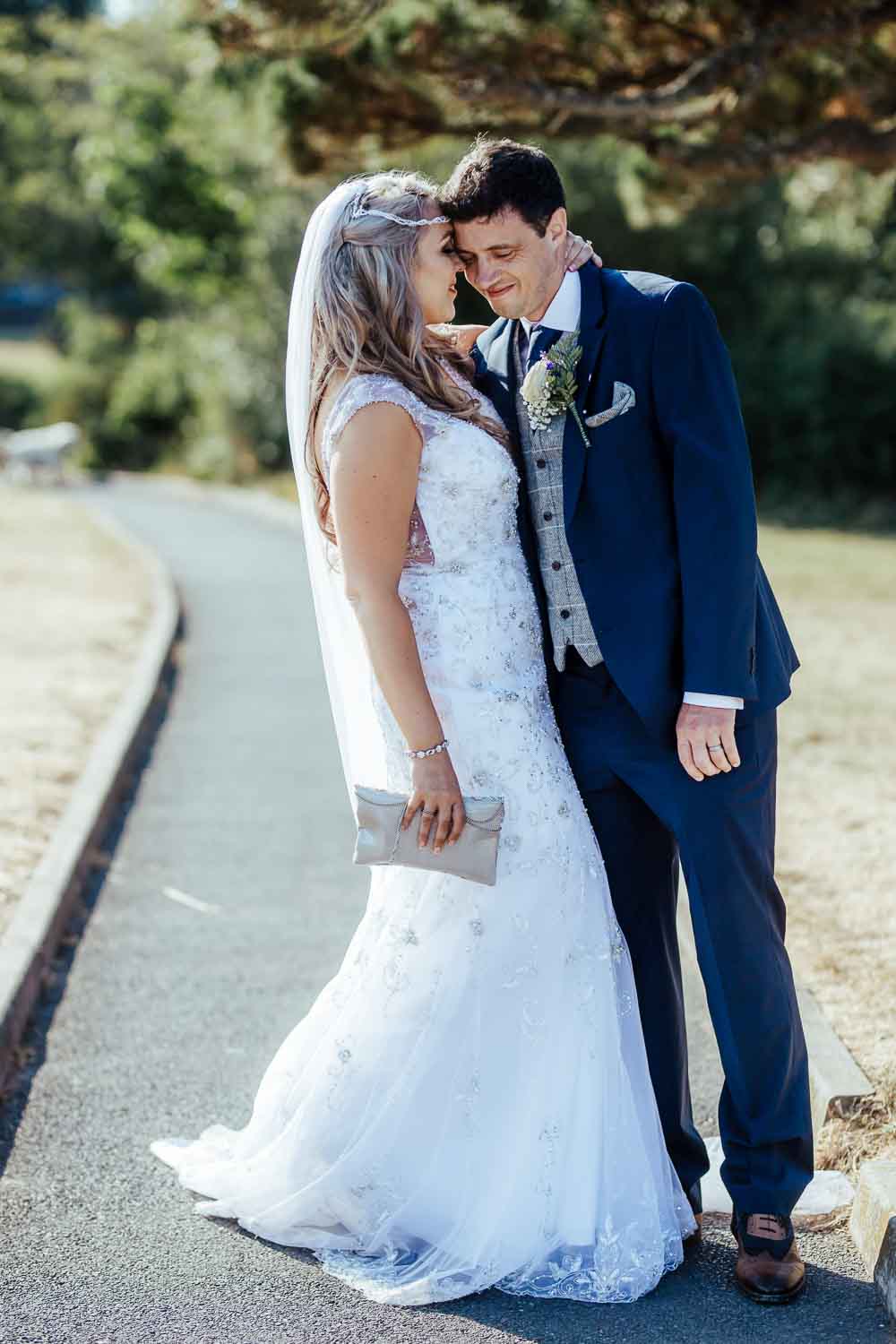 bride and groom holding each other during couple photoshoot