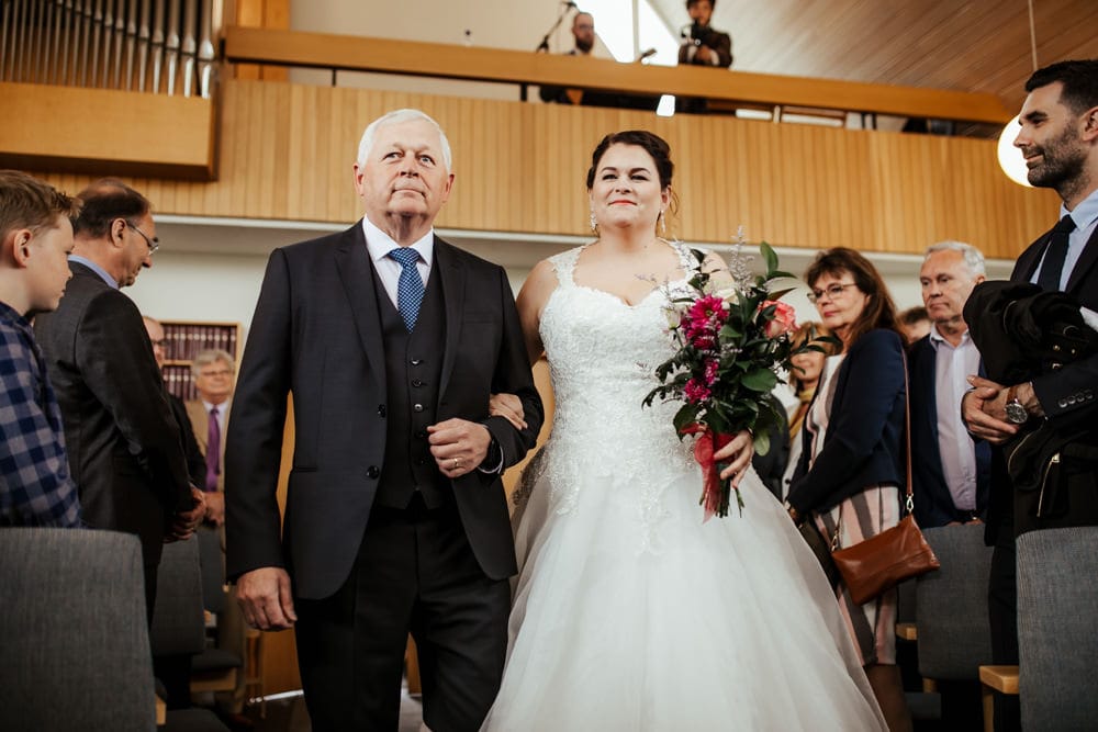 wedding ceremony in iceland church wedding bride and her father walking up the aisle