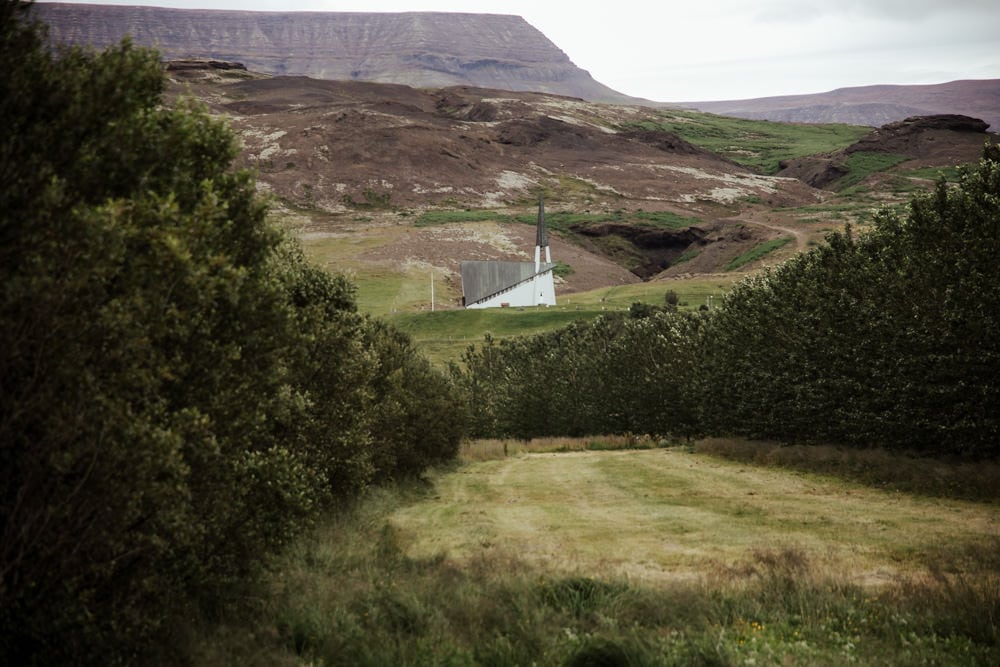 traditional icelandic church in the middle of the hillside
