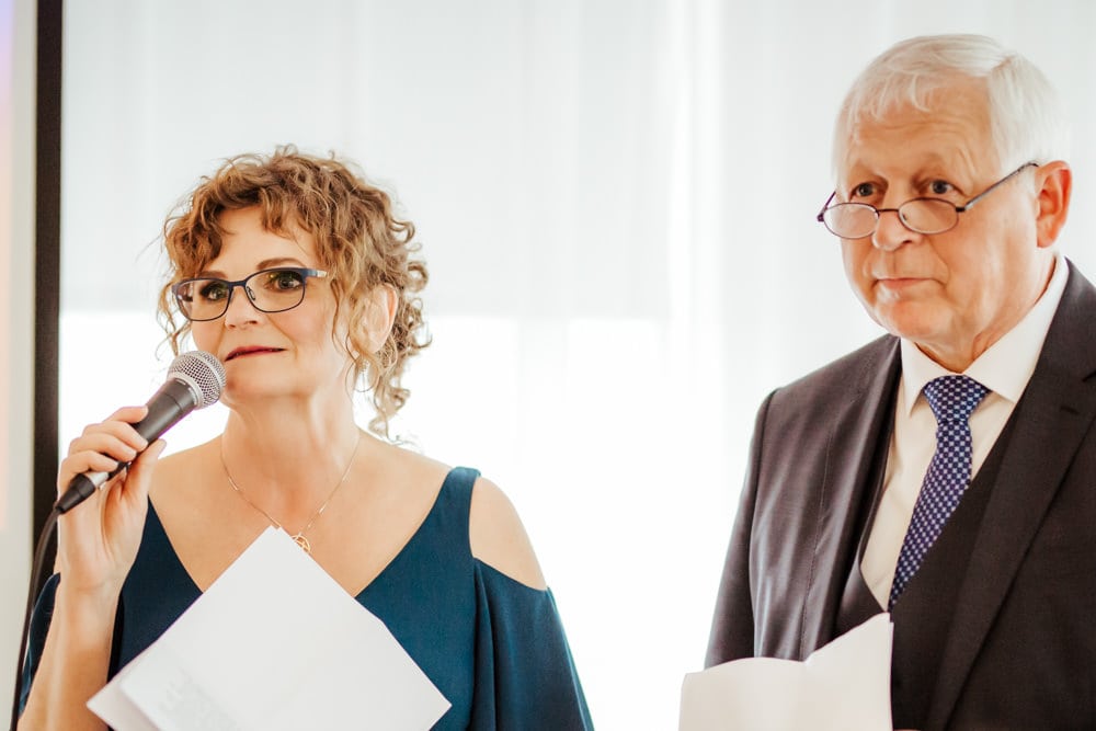 father and mother of the bride giving a speech at a wedding