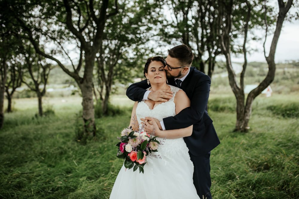 intimate photo of couple kissing wedding in iceland