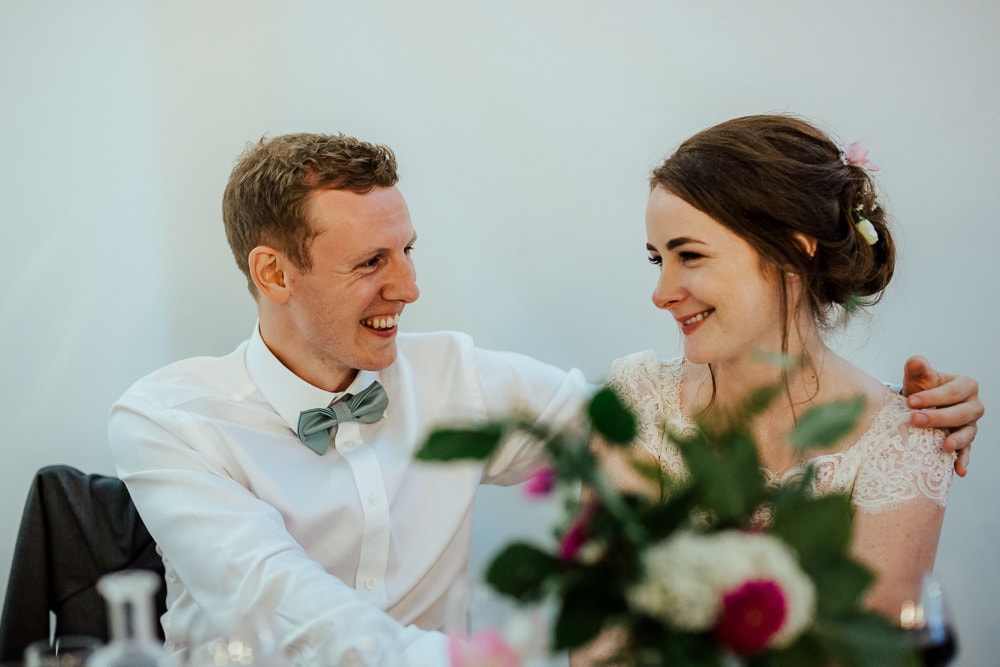 bride looking at groom during wedding speeches