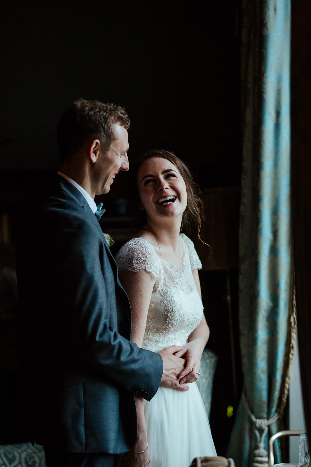 couple laughing on their horetown house wedding day