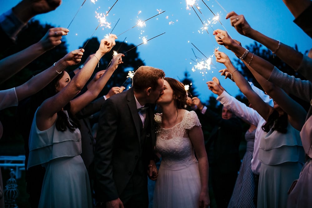 wedding couple kissing sparkler exit