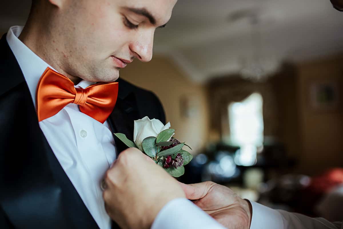 groom wedding details orange bow tie