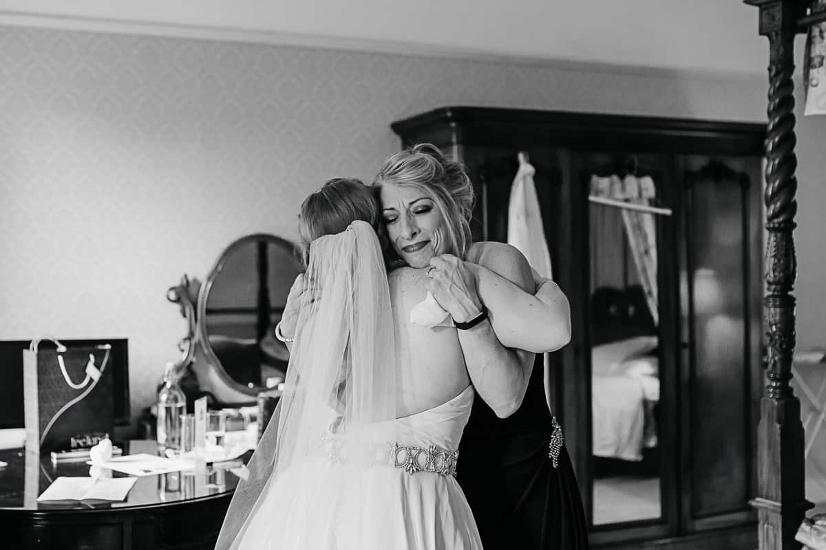 mother of the bride seeing her daughter in her wedding dress for the first time