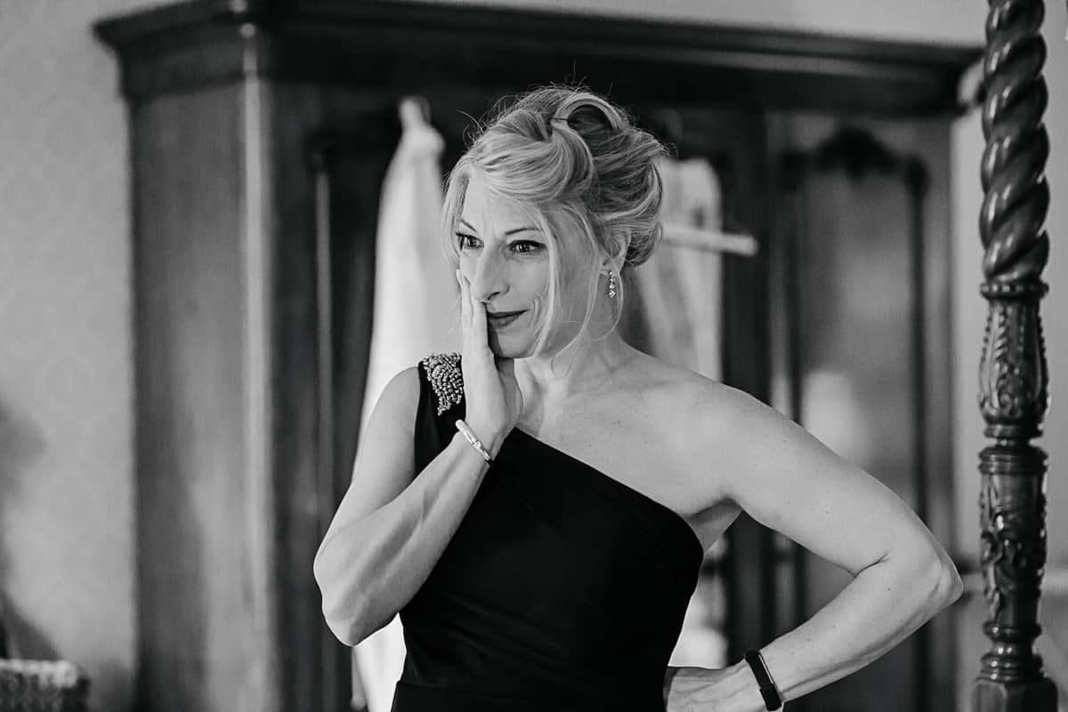 mother of the bride seeing her daughter in her wedding dress for the first time