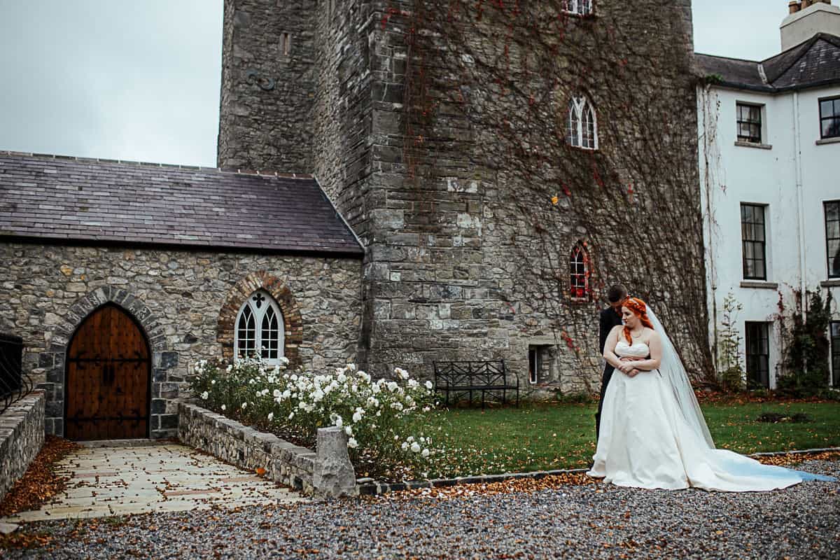 barberstown castle wedding portrait of bride and groom in front of the castle