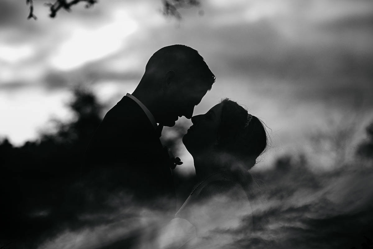 bride and groom silhouette double exposure