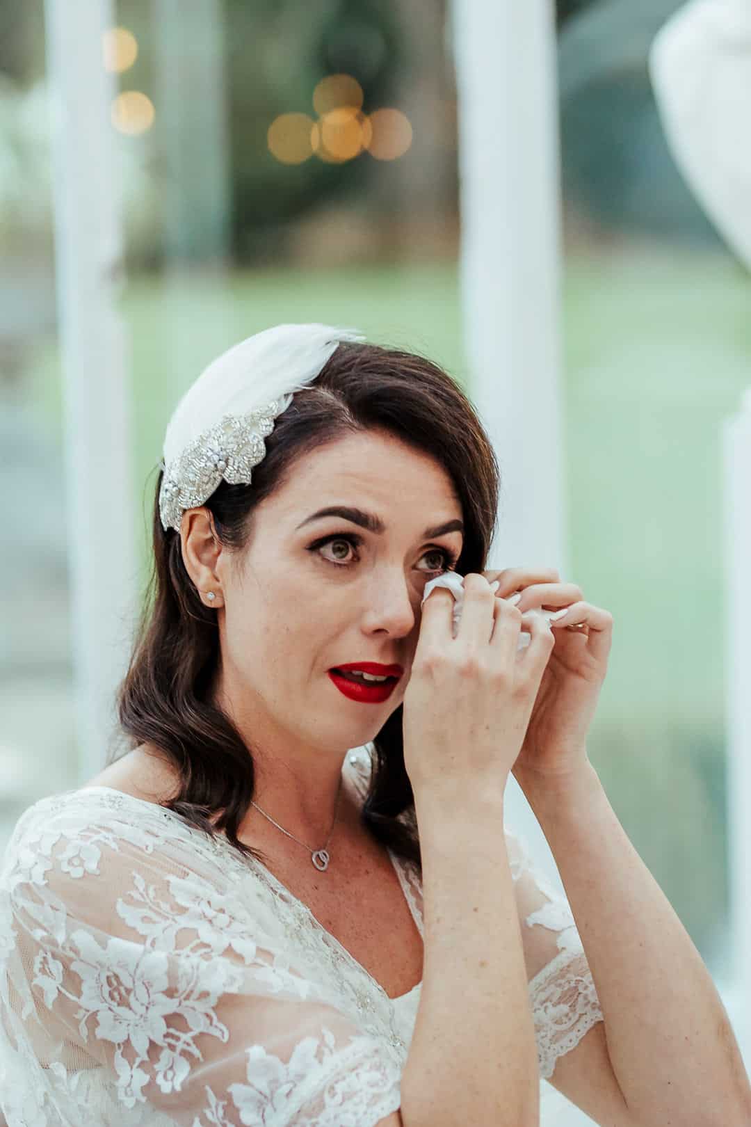 emotional bride tearing up during wedding speech