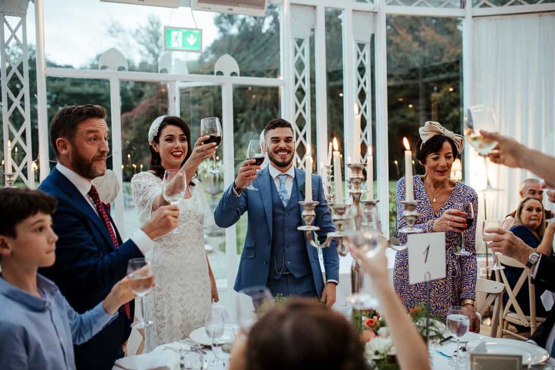 guests cheering to the newly married couple marlfield house wedding