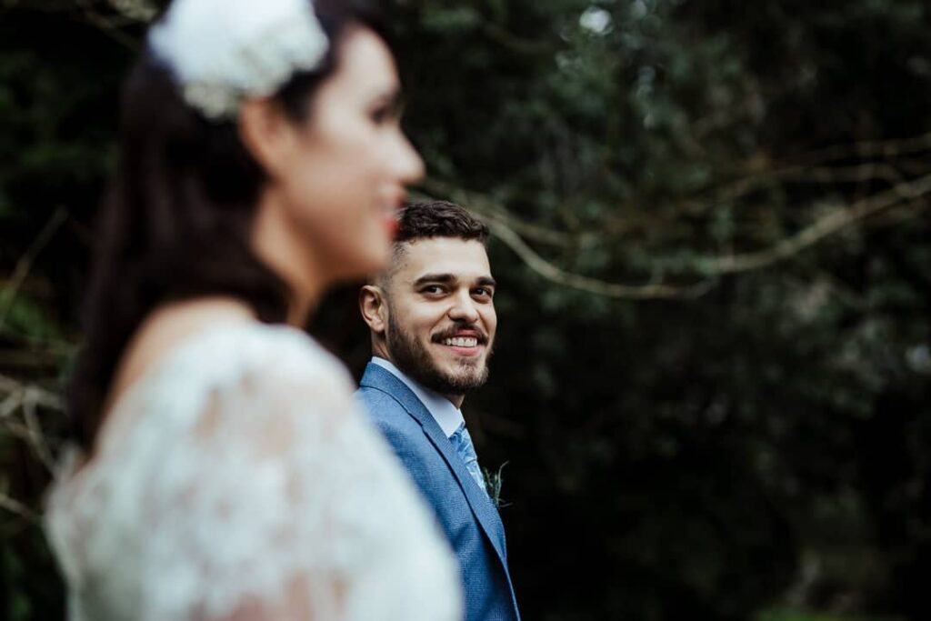 groom looking at the bride