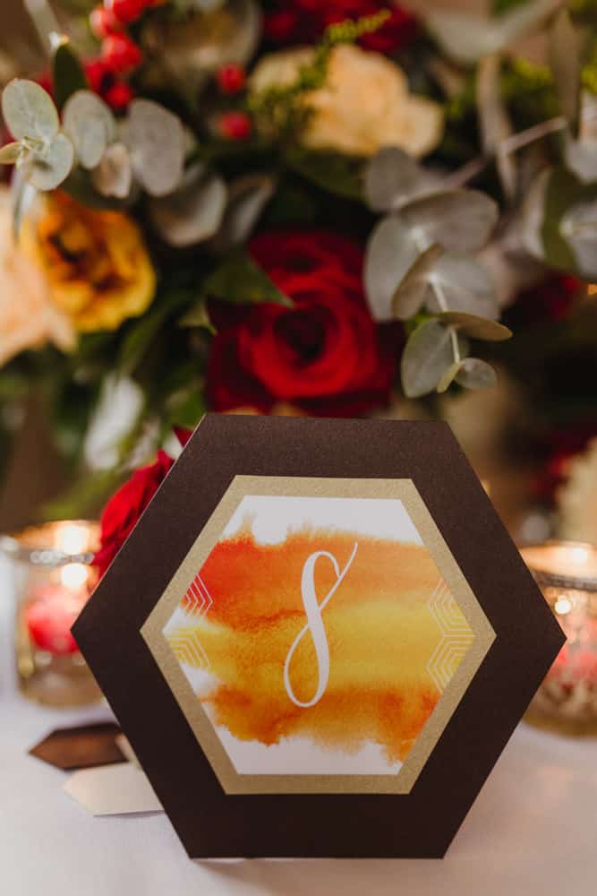 honeycomb inspired hexagonal table numbers wedding stationery
