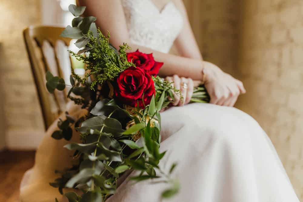 loose bridal bouquet with red roses autumn wedding florals