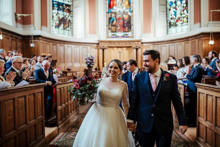 trinity college wedding bride and groom exit the church