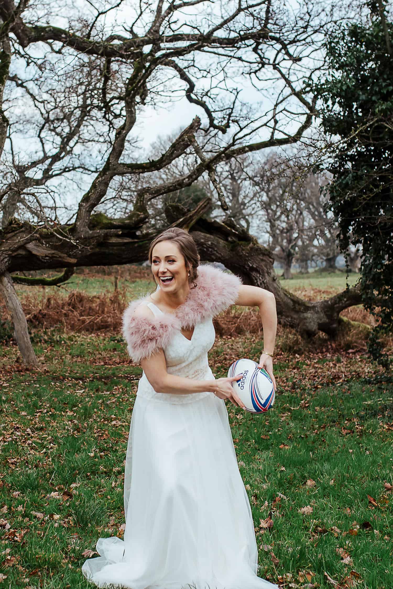 bride and groom playing rugby documentary wedding photographer ireland