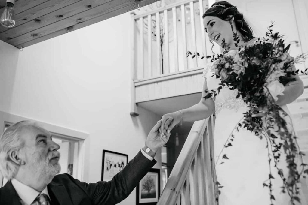 first look between father and daughter on wedding day