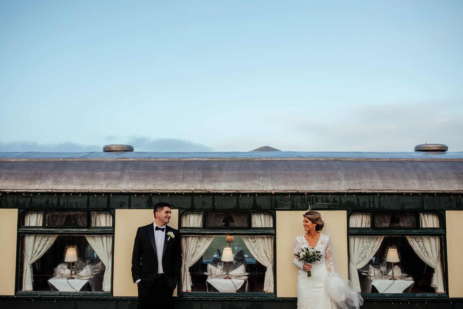 bride and groom at pullman train glenlo abbey wedding