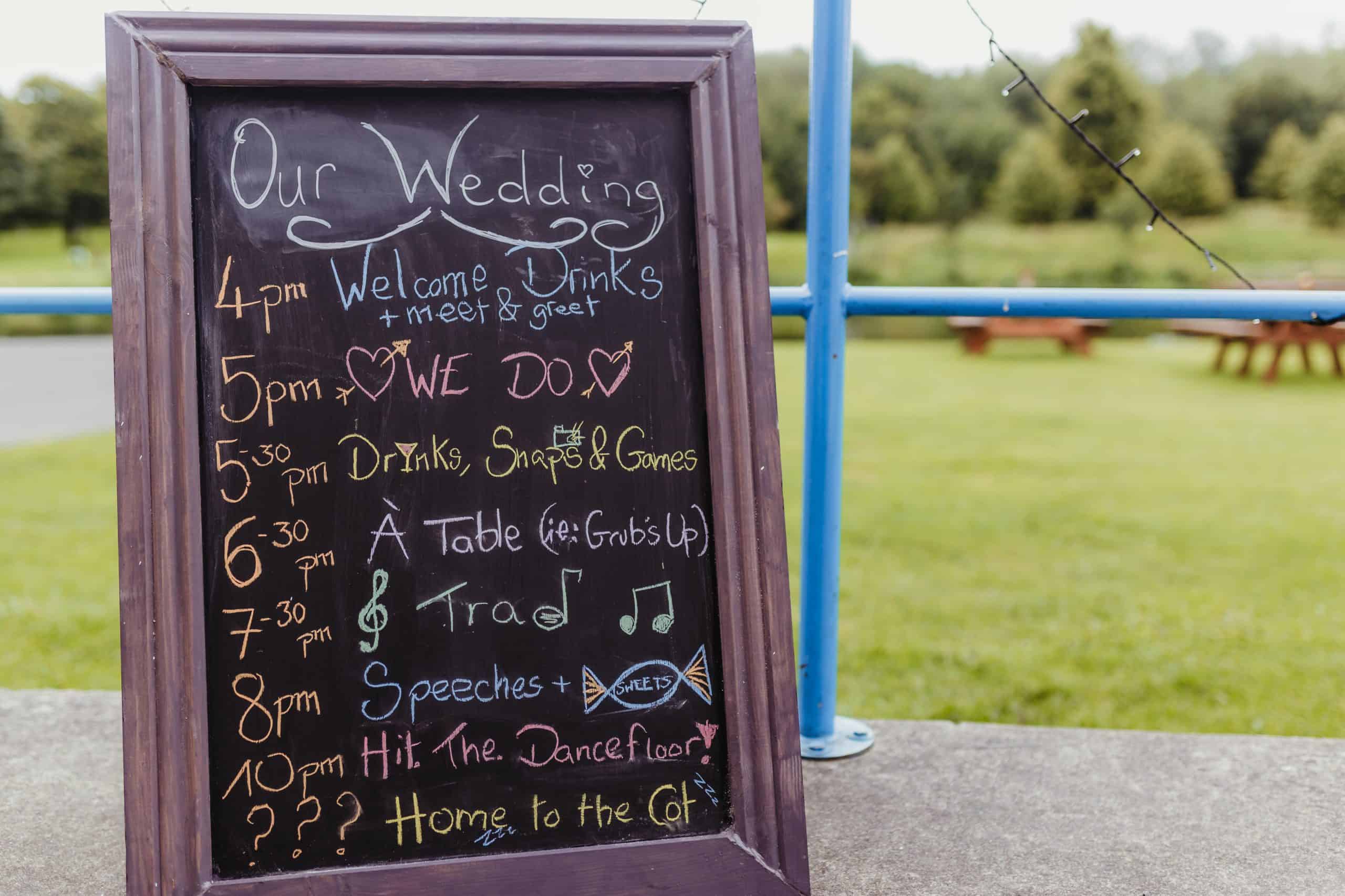 wedding day timeline sign at the venue